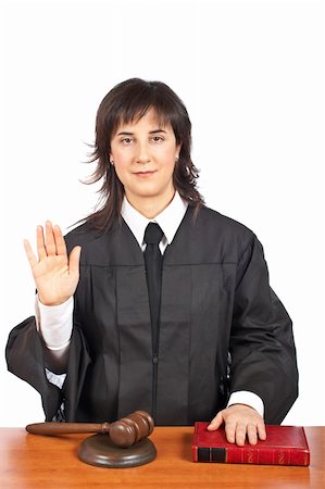simsearch:700-00028739,k - A female judge taking oath in a courtroom, isolated on white background. Shallow depth of field Stock Photo - Budget Royalty-Free & Subscription, Code: 400-04524208