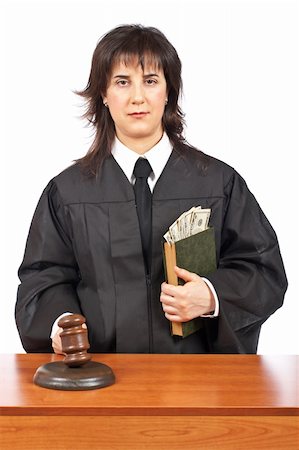 simsearch:700-00028739,k - A female judge in a courtroom striking the gavel, accepting a bribe. Shallow depth of field Stock Photo - Budget Royalty-Free & Subscription, Code: 400-04524209