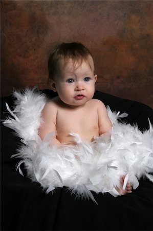 simsearch:400-05153083,k - Little Baby wrapped in white feathers Stock Photo - Budget Royalty-Free & Subscription, Code: 400-04524699
