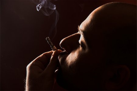 simsearch:400-05207678,k - close up of an smoking man Stock Photo - Budget Royalty-Free & Subscription, Code: 400-04525131