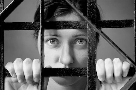 person trapped box - trapped woman behind iron bars Stock Photo - Budget Royalty-Free & Subscription, Code: 400-04526586