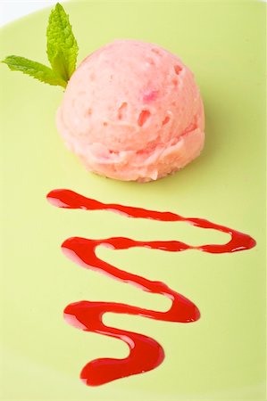 Delicious raspberries ice cream with syrup in green plate. Shallow depth of field Stock Photo - Budget Royalty-Free & Subscription, Code: 400-04529086