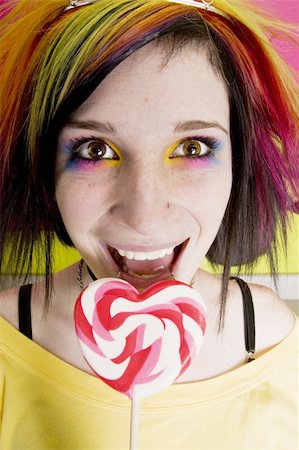 simsearch:400-04016564,k - Alternative Girl in a Colorful Kitchen with a Heart Lollipop Stock Photo - Budget Royalty-Free & Subscription, Code: 400-04520706