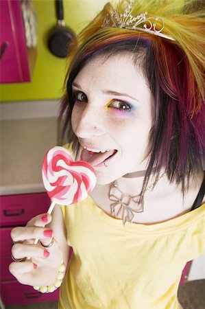 simsearch:400-04016564,k - Alternative Girl in a Colorful Kitchen with a Heart Lollipop Stock Photo - Budget Royalty-Free & Subscription, Code: 400-04520919
