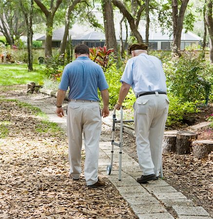 frail - Father and son strolling through the garden together.  The father is in a walker. Stock Photo - Budget Royalty-Free & Subscription, Code: 400-04521211