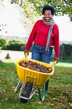 simsearch:400-04035087,k - Mature woman collecting autumn leaves in garden Stock Photo - Budget Royalty-Free & Subscription, Code: 400-04535472