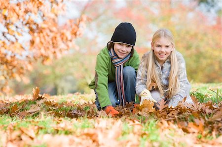 simsearch:400-04035087,k - Two children collecting autumn leaves Stock Photo - Budget Royalty-Free & Subscription, Code: 400-04535482