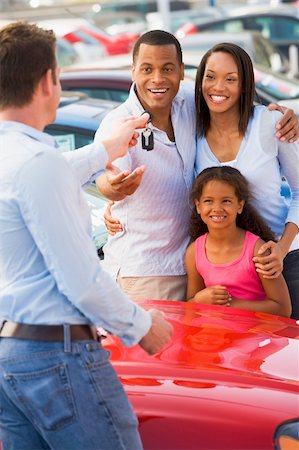 family car dealer - Family picking up new car from saleman Stock Photo - Budget Royalty-Free & Subscription, Code: 400-04536049