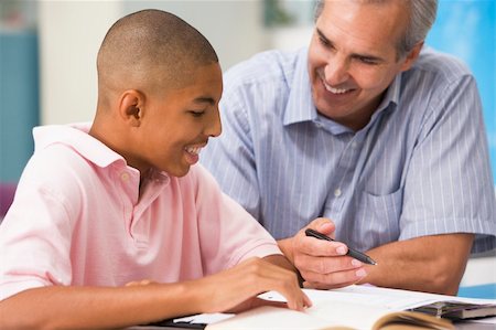 A teacher instructs a schoolboy in a high school class Stock Photo - Budget Royalty-Free & Subscription, Code: 400-04536529