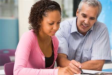 A teacher instructs a schoolgirl in a high school class Stock Photo - Budget Royalty-Free & Subscription, Code: 400-04536530