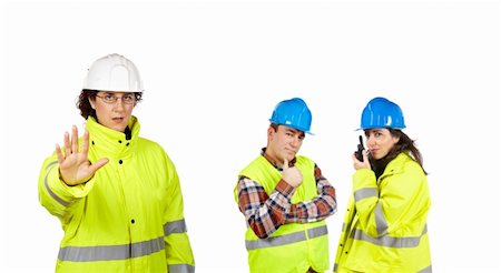 Three construction workers over a white background. Focus at front Stock Photo - Budget Royalty-Free & Subscription, Code: 400-04536772