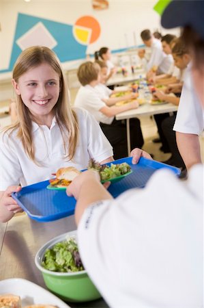 school lunch tray - A student collecting lunch from the school cafeteria Stock Photo - Budget Royalty-Free & Subscription, Code: 400-04537383