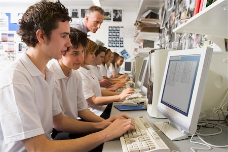 Row of schoolchildren studying in front of a computer Stock Photo - Budget Royalty-Free & Subscription, Code: 400-04537397