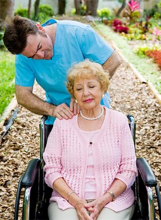 Senior woman in wheelchair receives massage therapy from a physical therapist. Stock Photo - Budget Royalty-Free & Subscription, Code: 400-04537904