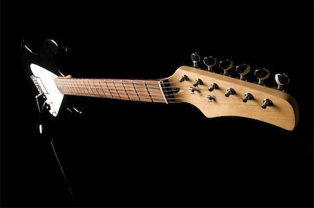 stringed instruments black background - Electric guitar isolated on black background Stock Photo - Budget Royalty-Free & Subscription, Code: 400-04530925