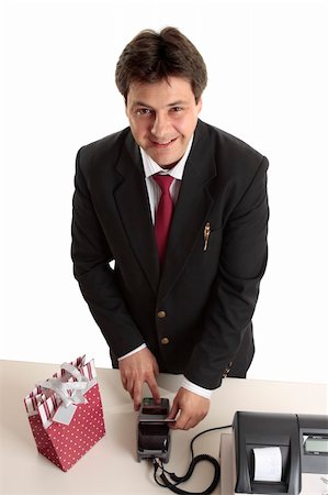 simsearch:400-05708287,k - A man dressed in suit buying a birthday, Christmas or special occasion present using credit or debit card. Stock Photo - Budget Royalty-Free & Subscription, Code: 400-04544552