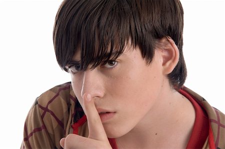 boy instructing you to keep silent on an isolated background Stock Photo - Budget Royalty-Free & Subscription, Code: 400-04545605