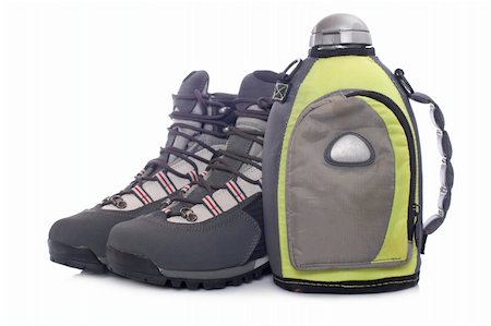 A pair of hiking boots and canteen with shadow, reflected on white background Stock Photo - Budget Royalty-Free & Subscription, Code: 400-04547250