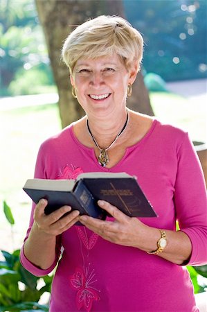 elderly woman reading bible in the garden Stock Photo - Budget Royalty-Free & Subscription, Code: 400-04549196