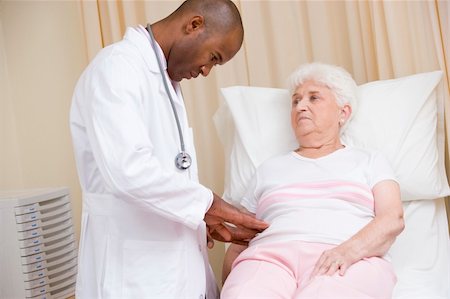 elderly african american women at the hospital - Doctor giving checkup to woman in exam room Stock Photo - Budget Royalty-Free & Subscription, Code: 400-04540613