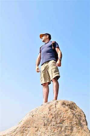 Middle aged hiker standing on top of a mountain Stock Photo - Budget Royalty-Free & Subscription, Code: 400-04540826