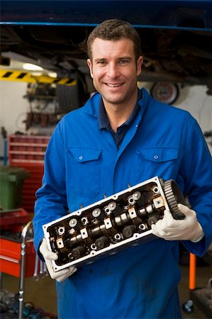 self-employed (male) - Mechanic holding car part smiling Stock Photo - Budget Royalty-Free & Subscription, Code: 400-04540984