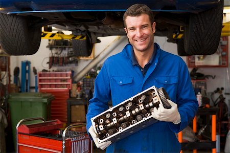 self-employed (male) - Mechanic holding car part smiling Stock Photo - Budget Royalty-Free & Subscription, Code: 400-04540983