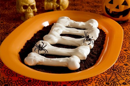 Halloween meringue bones on dirt (crashed Oreo Cookies) Stock Photo - Budget Royalty-Free & Subscription, Code: 400-04541405