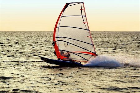simsearch:400-03992760,k - Silhouette of a windsurfer on a gulf, moving at great speed Stock Photo - Budget Royalty-Free & Subscription, Code: 400-04554310