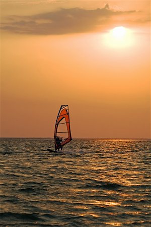 simsearch:400-03992760,k - Silhouette of a windsurfer on a gulf on a sunset Stock Photo - Budget Royalty-Free & Subscription, Code: 400-04554312