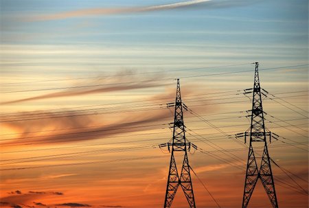 High voltage tower on a background of the red sky Stock Photo - Budget Royalty-Free & Subscription, Code: 400-04558317