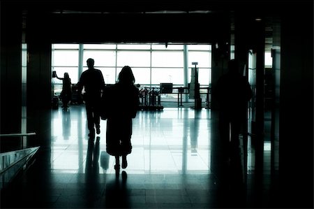 shadow plane - people silhouettes walking in an airport Stock Photo - Budget Royalty-Free & Subscription, Code: 400-04558354