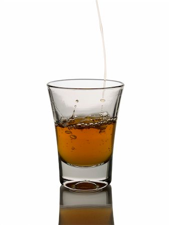 simsearch:400-04558755,k - Pouring a shot of whisky on white background Stock Photo - Budget Royalty-Free & Subscription, Code: 400-04558754