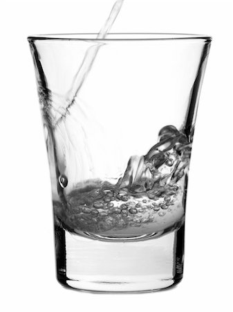 simsearch:400-04558755,k - Pouring a shot of vodka on white background Stock Photo - Budget Royalty-Free & Subscription, Code: 400-04558752