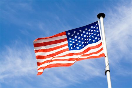 simsearch:400-06086537,k - Waving american flag on blue sky backfground Stock Photo - Budget Royalty-Free & Subscription, Code: 400-04558984