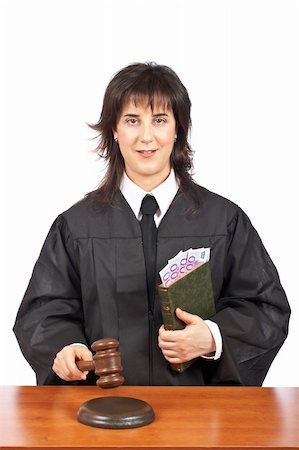 simsearch:700-00028739,k - A female judge in a courtroom striking the gavel, accepting a bribe. Shallow depth of field Stock Photo - Budget Royalty-Free & Subscription, Code: 400-04559013