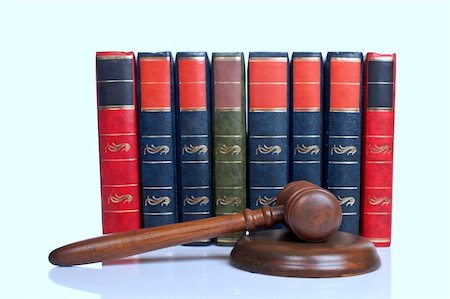 simsearch:700-00028739,k - Wooden gavel from the court and old law books isolated on white background. Shallow depth of file Stock Photo - Budget Royalty-Free & Subscription, Code: 400-04559541