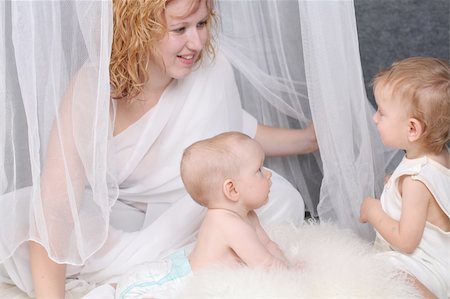White family - mother takes care about angel like children Stock Photo - Budget Royalty-Free & Subscription, Code: 400-04559758