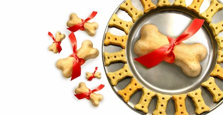 piles of bones - Doggy biscuits for christmas against white background Stock Photo - Budget Royalty-Free & Subscription, Code: 400-04550996