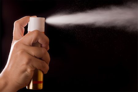 aerosol can spraying on black background Stock Photo - Budget Royalty-Free & Subscription, Code: 400-04553017