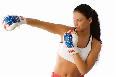 simsearch:400-04970057,k - nice young woman in boxing dress in act to beat with direct punch Stock Photo - Budget Royalty-Free & Subscription, Code: 400-04553880