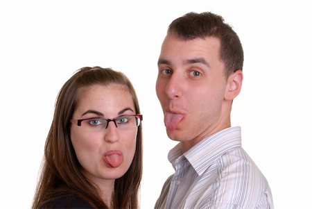 sticking out her tongue - attractive young couple playfully poking out their tongues - on white Stock Photo - Budget Royalty-Free & Subscription, Code: 400-04565201