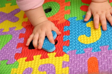 simsearch:400-04331637,k - child playing multi colored alphabet puzzle Stock Photo - Budget Royalty-Free & Subscription, Code: 400-04566866