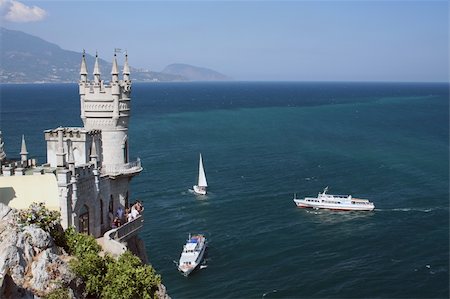 The castle Swallow's Nest near Yalta with different ships Stock Photo - Budget Royalty-Free & Subscription, Code: 400-04568988