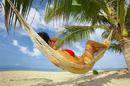 simsearch:400-03950469,k - view of nice woman lounging in hammock in tropical environment Stock Photo - Budget Royalty-Free & Subscription, Code: 400-04560146