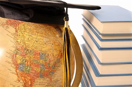 Antique globe, graduation cap and books on white background Stock Photo - Budget Royalty-Free & Subscription, Code: 400-04561816