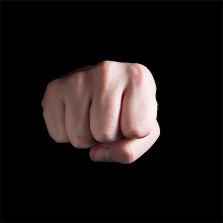 simsearch:400-04586134,k - A male´s fist isolated on black background. Stock Photo - Budget Royalty-Free & Subscription, Code: 400-04574792