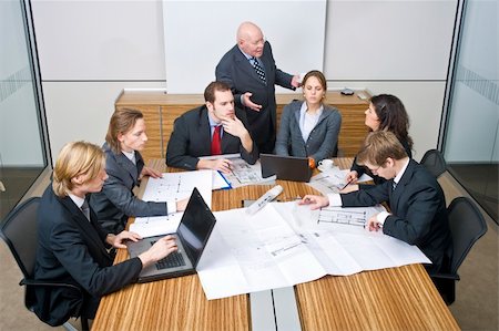 A business team going over the design changes at a corporate architectural firm Stock Photo - Budget Royalty-Free & Subscription, Code: 400-04575463
