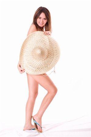 simsearch:400-07421488,k - Sexy girl. Being covered with the big hat. Isolated on white background Stock Photo - Budget Royalty-Free & Subscription, Code: 400-04576745