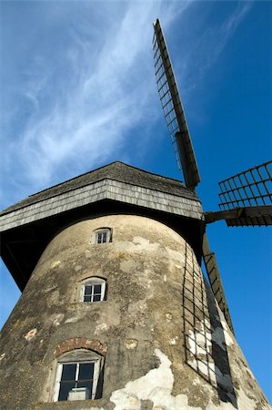 simsearch:400-05319608,k - Traditional Old dutch windmill in Latvia against blue sky with white clouds Stock Photo - Budget Royalty-Free & Subscription, Code: 400-04577863